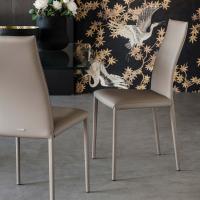 Kay is a chair with tall quilted curved back by Cattelan, proposed also with smooth back