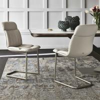 Kelly Cantilever upholstered cantilever chair, with base in embossed metal and upholstery in leather