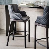 Magda stool by Cattelan in the model with armrests and quilted backrest