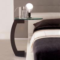 Zen side table next to the bed by Cattelan, with clear glass top