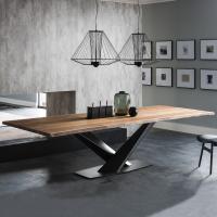 Stratos is a wooden dining table with central metal crossed plinth by Cattelan