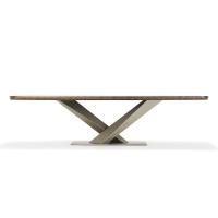 Stratos dining table with crossed structure and lower rounded profile
