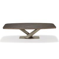 Stratos dining table with crossed metal plinth and lower rounded profile
