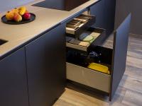 Detail of the kitchen big drawers in elegant black colour