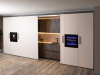 Concealed kitchen with two pairs of folding doors 