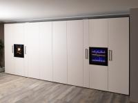 Concealed kitchen with doors concealing the working area consisting of stove top and sink