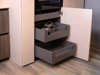 Base unit with pull-out drawers and baskets equipped with telescopic runners