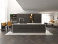 Kitchen with central island and integrated table top
