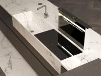 Detail of the Brick marble system with sink and induction hob