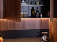 Detail of the canaletto walnut back panel and backsplash in black Fenix