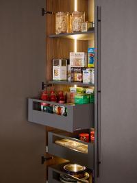 Storage column with shelves and baskets for enhanced storage space and convenience of use