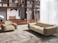 Linear sofa matched to the armchair of the same collection to create a more traditional styled living room