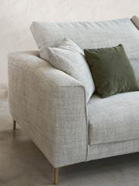 Detail of Foster sofa with fabric cover and champagne metal feet