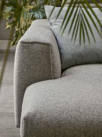 Detail of the armrest and upholstered seats of the Foster sofa