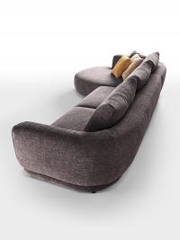 Focus on the curved backrest which forms a single piece with the armrests