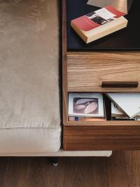Detail of the armrest container made from canaletto walnut wood with a top in black hide leather
