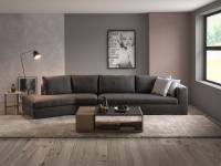 Holiday modern sofa with an inclined peninsula, in the version with backrest cushions, upholstered in dark grey fabric