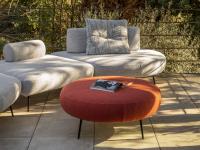 Island modern sofa with mobile backrests with the matching round pouffe