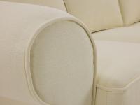 Levante classic fabric sofa with flounces, detail of the round armrest with matching piping