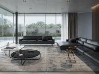 A large living room with two Maxime sofas in black leather, one in the linear version and one with the maxi chaise-longue