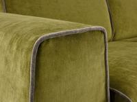 Detail of the piping in cotnrast that runs along the shape of the sofa bed armrests and cushions