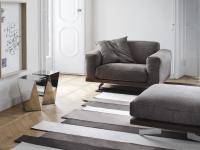 Armchair and pouffe which match the Raymond sofa with bases in walnut wood and chromed metal feet