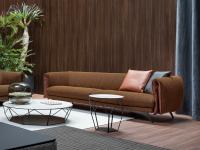 Saddle designer upholstered tub sofa with elegant folded inserts