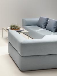 Swing modular sofa with curved lines and padded armrests and backrest