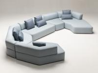 Modular, modern sofa with curved lines and curved stitchwork Swing