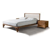 Katai is a slim real wood bed frame in natural walnut wood