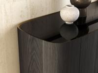 Detail of the black painted glass top and contrasting raised bronze profile of the Lena sideboard
