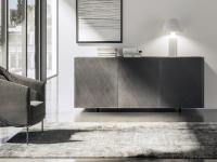 Frontal view of Maia modern sideboard with metal feet, top and doors in brushed bronze.