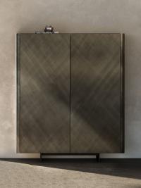 Frontal view Maia cupboard with metal feet, top and doors in brushed bronze