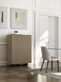 Maia modern cupboard with metal feet, solid wood top painted in Black Ash and doors with smooth leather cover