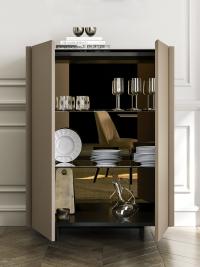 Detail of the modern cupboard Maia with internal smoked glass shelves and bronze mirror back