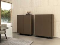 Composition of two modern cupboards Maia with metal feet and quilted leather doors