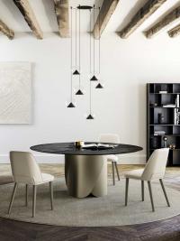 Lola chandelier with glass and metal diffusers combined with the Torquay table from the same collection