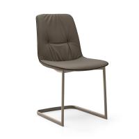 Betta elegant chair with faux-leather piping. Leather cover and cantilever base in Titanium painted metal.