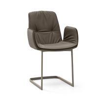 Betta elegant chair with faux-leather piping and armrests. Leather cover and cantilever base in Titanium painted metal