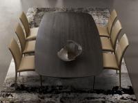 Upholstered Europa leather chairs covered and matched to dining table with wooden top