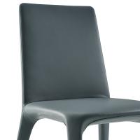 Close up of the India fully-upholstered chair, with seat and legs upholstered in leather