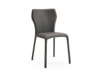Front view of the Miele padded chair with hexagonal backrest. Legs and seat are fully upholstered in leather.