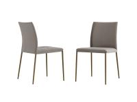 Rosa upholstered chairs with smooth backrest. Metal legs and body upholstered in Nabuk leather.