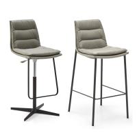 Dama swivel stool with spokes and Dama stool with metal legs. Leather upholstery and painted-aluminium legs in the Charcoal finish.