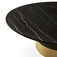 Close up of the Hidalgo round coffee table with cylindrical base and marble top in the Nero Marquinia finish. Two-tone base in a Black finish with contrasting lower ring in Gold.