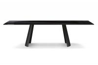 Edwin fixed table with sail-shaped base from above. Rectangular tabletop in glossy-black painted glass and base in Black painted metal.