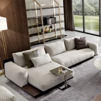 Victor sofa with chaise longue with a luxury design. It has a nice structure covered in leather and the seat and backrest cushions are in fabric, with goose down filling