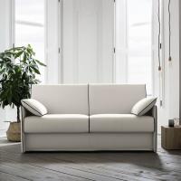 Brian sofa bed in an elegant white fabric cover and contrasting piping