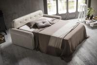 Open sofa bed with tufted headboard with buttons in the same colour of the headboard cover