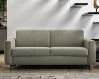 William sofa bed with fabric upholstery and tall legs in bronzed metal